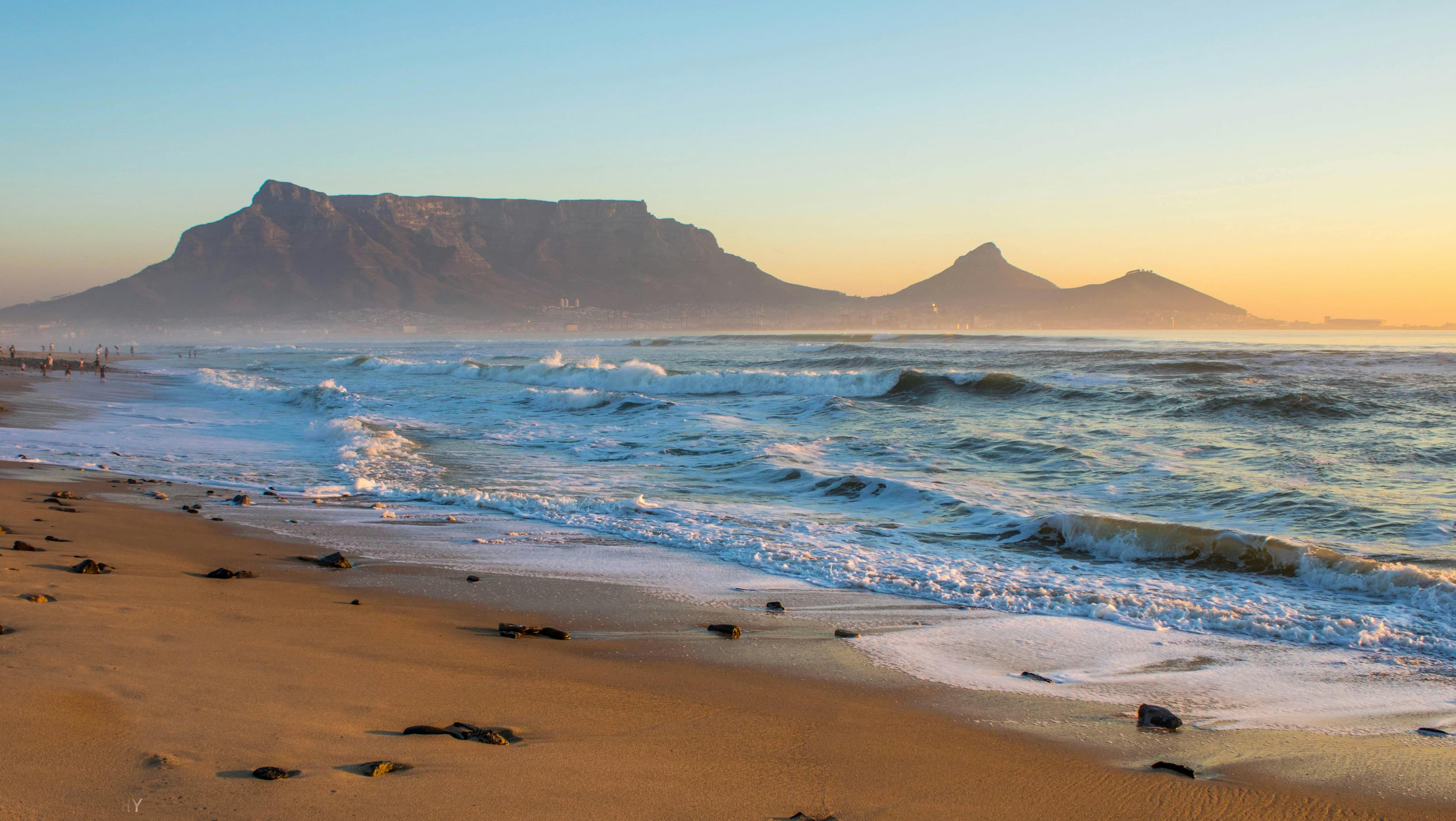 Waves breaking at sunset along Bloubergstrand